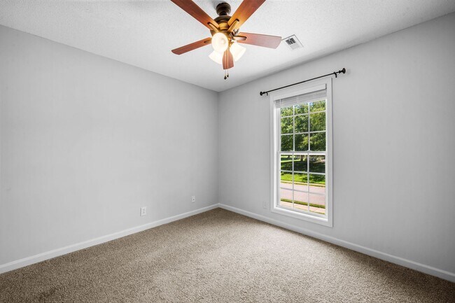 Building Photo - Stunning Stone Fireplace • Finished Basement • Fenced Yard