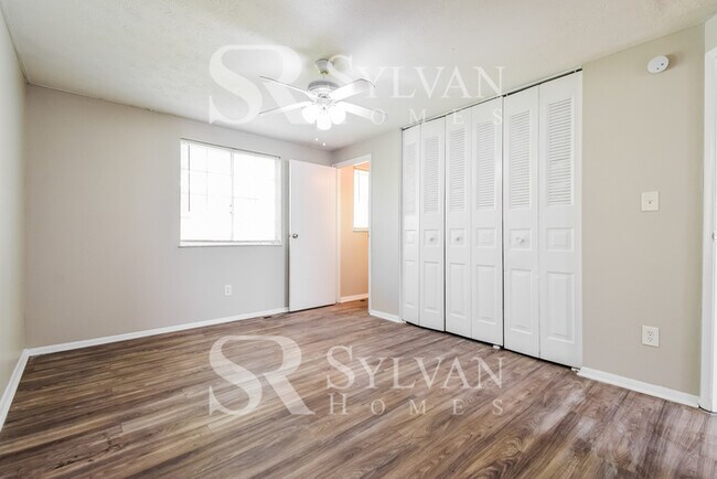 Building Photo - The living is easy in this 4 bedroom, 2 ba...