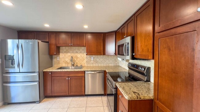 Building Photo - Enjoy Half Off Your First Month's Rent! 3-bedroom, 2.5-bath Split-Level Condo