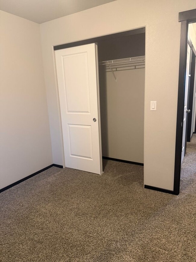 Building Photo - Lots of storage space in this 4- Car garage for all your playthings!!