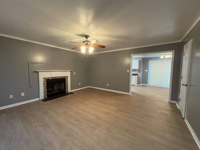 Building Photo - Spacious 4-Bedroom Sanctuary with Cozy Fireplace on Chimney Swift Drive!