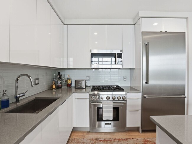 Building Photo - Designer-Furnished Waterfront Living at VIO Condominiums!