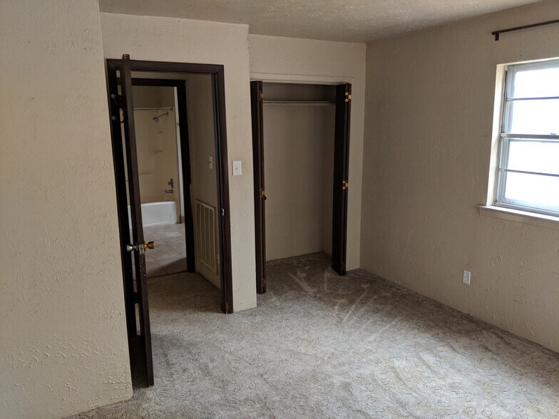 Master Bedroom. We are replacing the carpet with premium LVP. - 5235 Highway NN