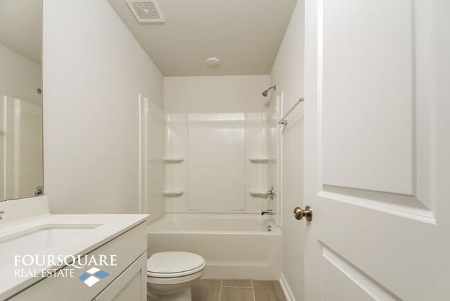 Building Photo - Modern 3-Story Townhome with First-Level B...