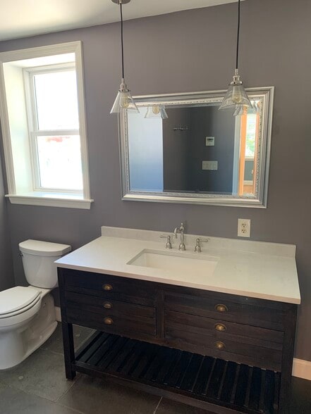 Primary bedroom full bath. - 2241 12th Plz NW