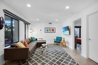 Building Photo - Stylish Ground-Floor Condo in Gated Palm S...