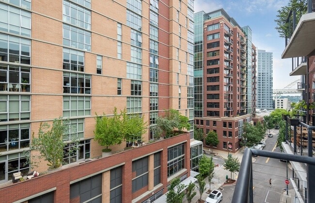 Building Photo - 1/2 Month FREE: Rare Streetcar Lofts Gem w/ Parking & Utilities