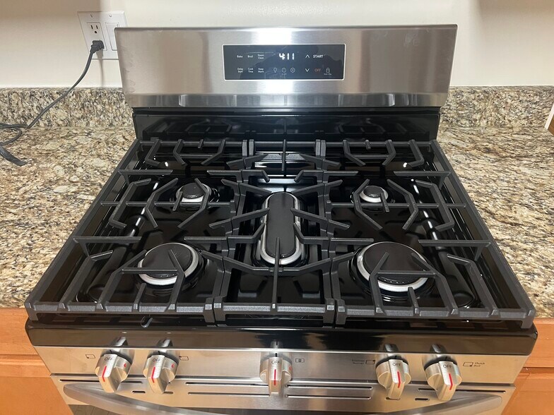 Five burner stove - 3748 W Lyndale St