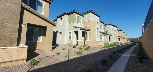 Building Photo - Beautifully designed modern townhome with attached garage.