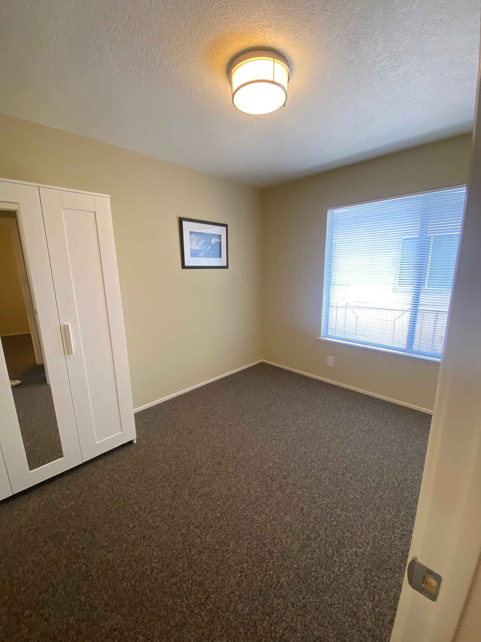 Second bedroom with mirrored armoire - 3833 Maybelle Ave