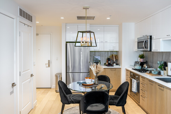 This fully equipped kitchen features modern appliances all essentials, ready for you to move in - 400 S Broadway