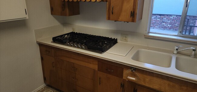 Building Photo - This is a spacious house featuring four bedrooms and two bathrooms, along with a two-car garage.