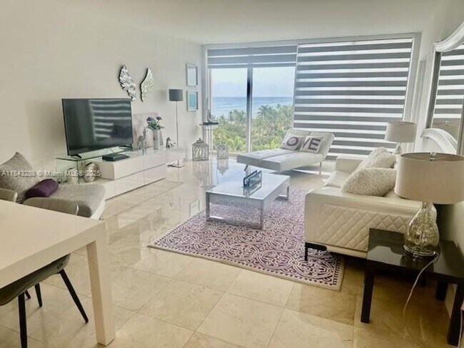 Building Photo - 10275 Collins Ave