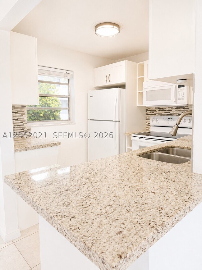 Building Photo - 6095 W 18th Ave