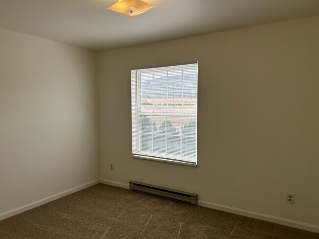 Building Photo - Quiet and Sunlit Townhome with Attached Garage and Washer/Dryer Included