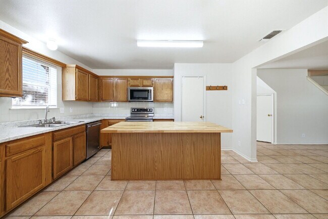 Building Photo - 4 Bedroom home with ZERO carpet close to RAFB