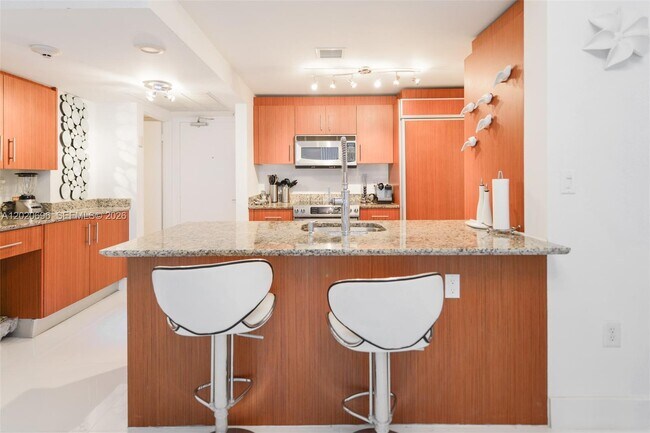 Building Photo - 10275 Collins Ave