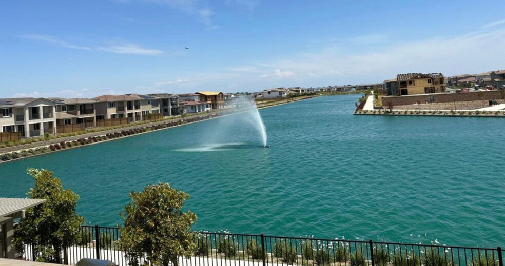 Man-made lake to walk around two blocks away. - 5919 Lakestone Dr