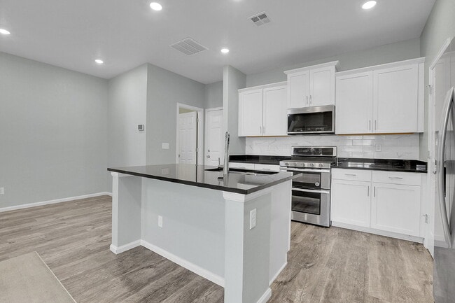 Building Photo - $2,395.95- 3 Bed, 2.5 Bath Townhome with Central AC, and In Unit Laundry!