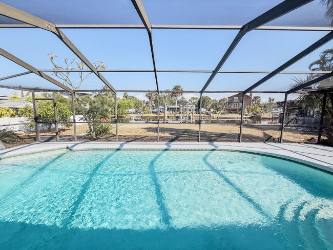 Building Photo - WATERFRONT POOL HOME ON A CANAL THAT LEADS STRAIGHT INTO TAMPA BAY