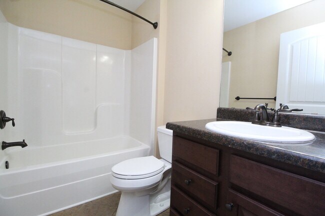 Building Photo - Beautiful 3BR/2BA Brick Home with Granite Kitchen, Covered Patio, Fire Pit & 2-Car Garage Near I-10