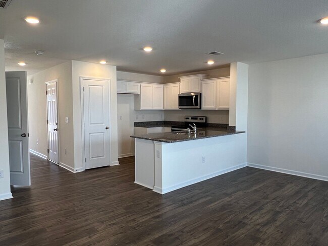 Building Photo - Beautiful New Construction 3 bedroom 2.5 Condo   with garage- Water, trash & sewer incuded!