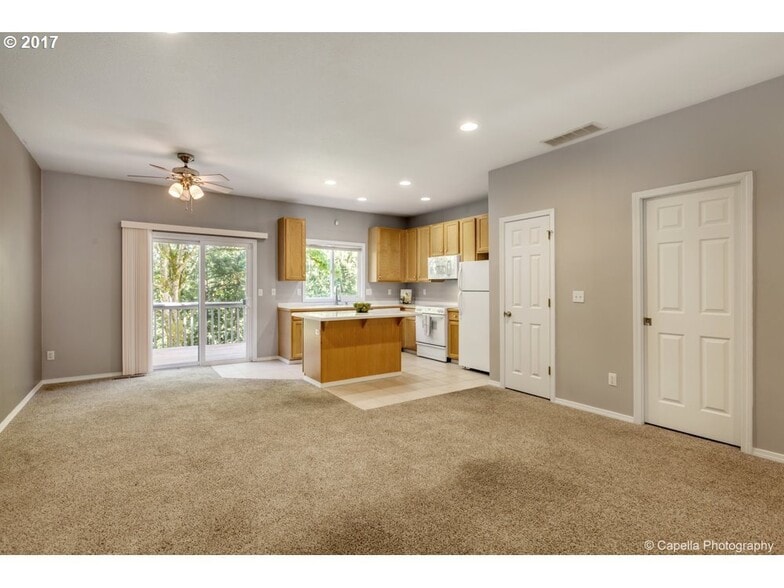 Open Concept Living and Dining Room leading to deck - 7414 NE Shaleen St