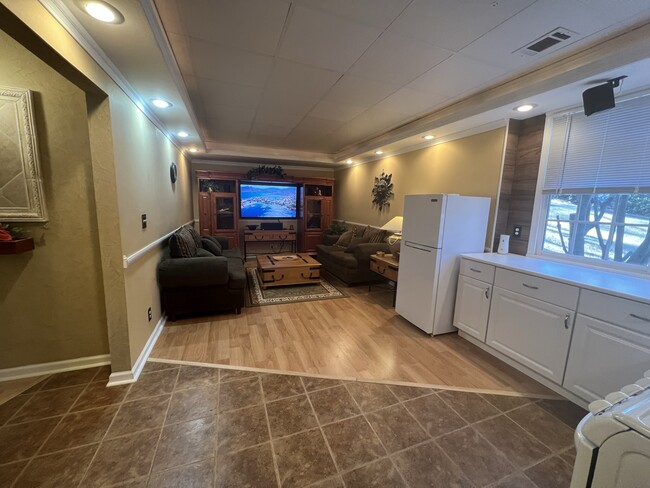 Living room and kitchen - open floor plan with windows - 3617 Sunset Rdg