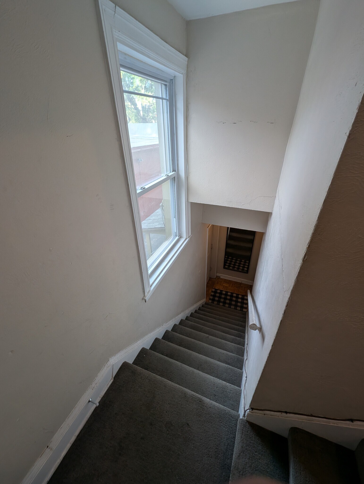 Common stairwell from side entry door to upper units - 3404 Baltimore Ave