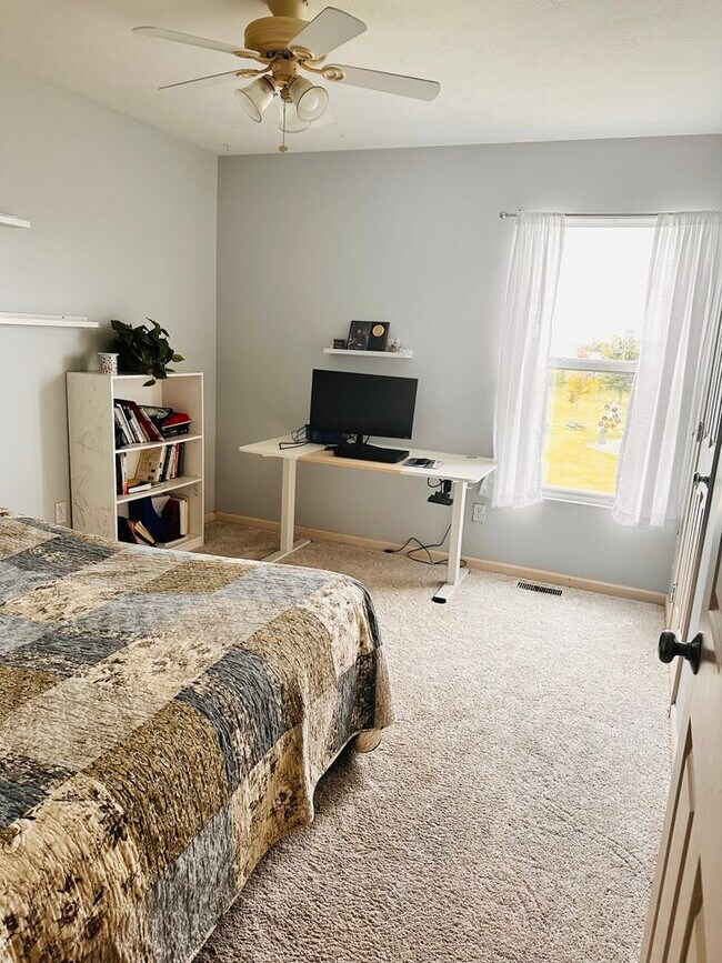 A third bedroom featuring brand-new carpeting - 4555 Cider Wood Dr NW