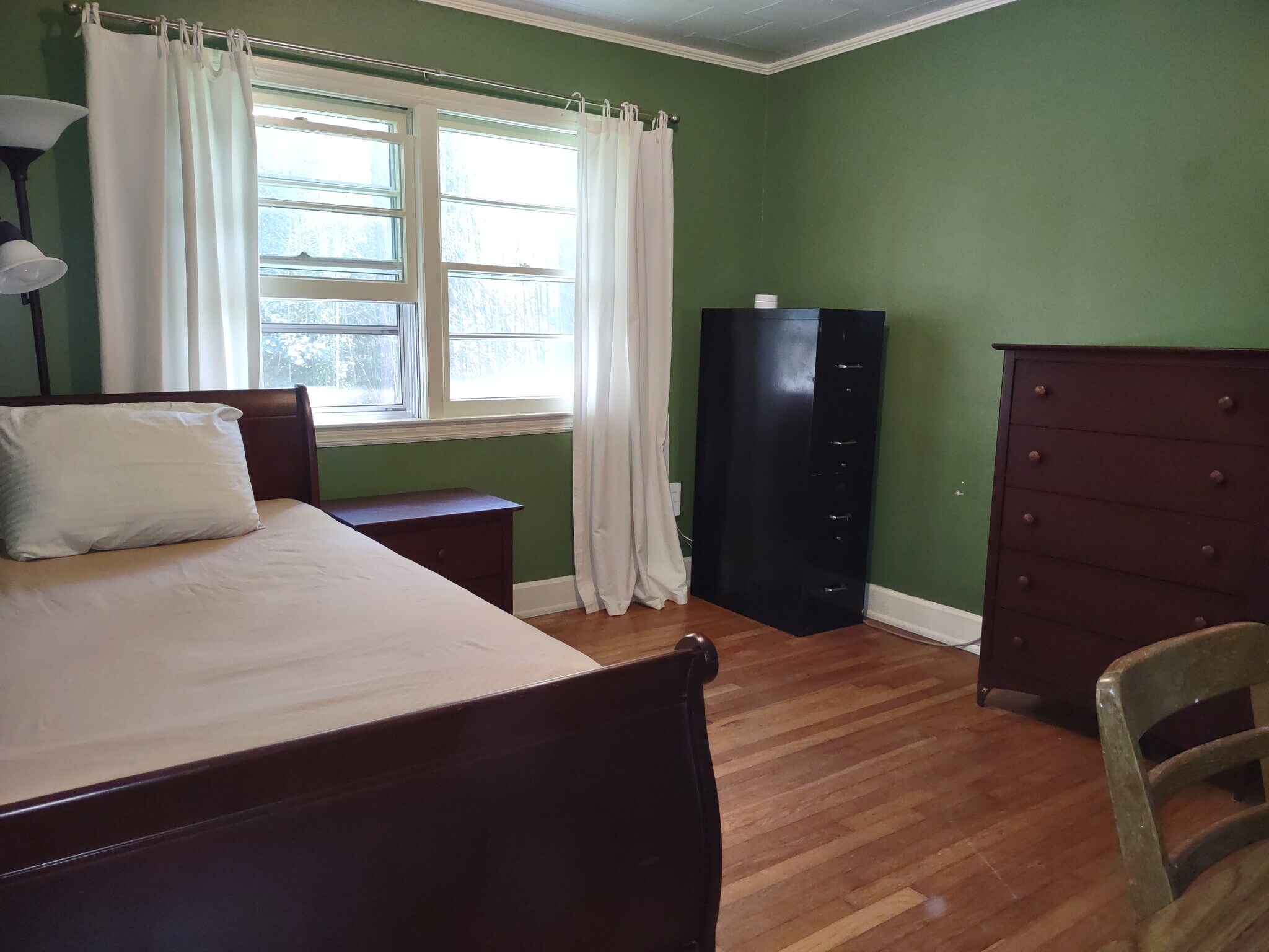 Second bedroom has single bed, bedside table, dresser, file cabinet, desk, and chair. - 223 Barclay Road
