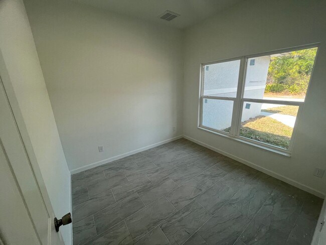 Building Photo - BRAND NEW MODERN SF HOME 3BD+den/2BA with GARAGE IN LEHIGH ACRES!