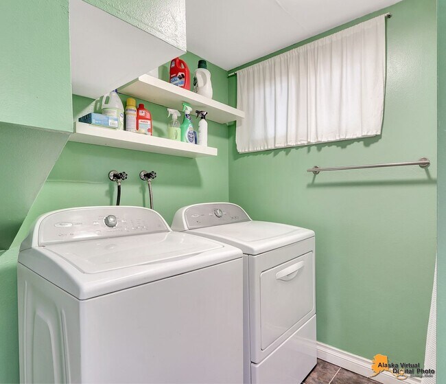 Building Photo - Eagle River Home w/ Fenced Yard, Sunroom, and Garage!