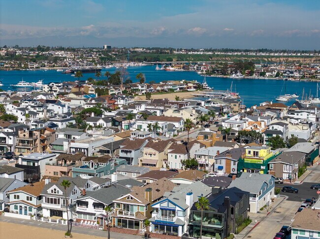 Building Photo - "Coastal Tommy Bahama at 208 East Balboa: Fully Furnished 3-Bed Sanctuary with Rooftop Deck