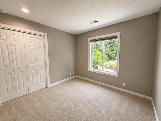Building Photo - Light-Filled 4 Bedroom Retreat with Waterfall & Fully Fenced Yard