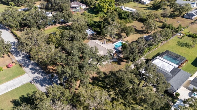 Building Photo - Country-Style Sarasota Living on a Full Acre - Pool Home with Oversized Workshop — Move-In Ready Now