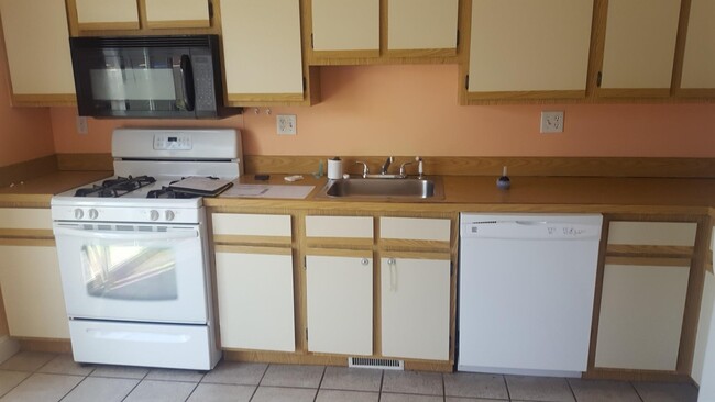 Kitchen with appliances - 1237 Pawtucket Blvd