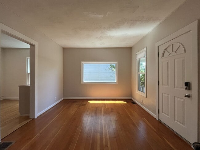 Building Photo - Charming Cottage with Hardwood Flooring, Modern Kitchen & Beautiful Outdoor Living Areas