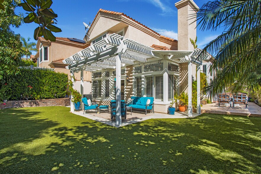 Primary yard with stacked stone and artificial turf - 35 Inverary