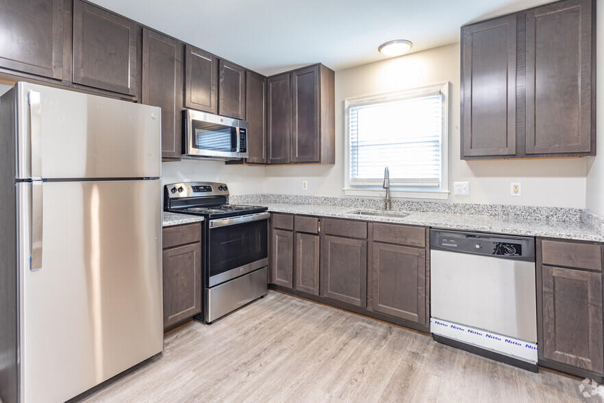 Modern Kitchen with Stainless-Steel Appliances + Granite Countertops - Legacy at Tech Center