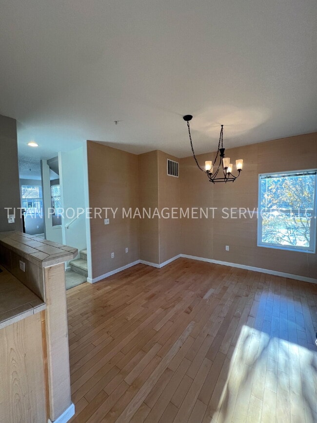 Building Photo - Beautiful Three Story Townhouse with Gas Fireplace, Balcony & 2-Car Garage