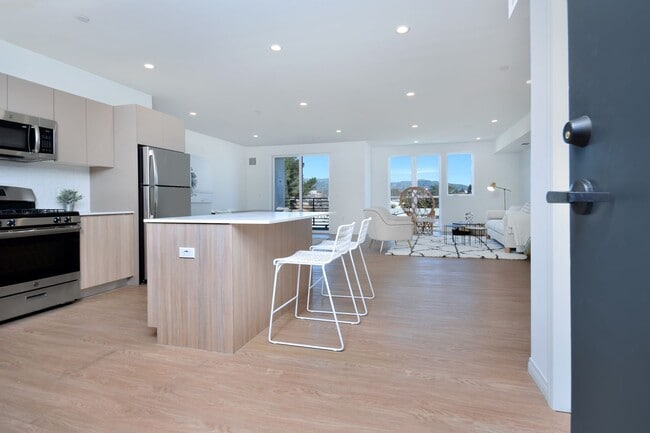 Building Photo - ~ 4 Bedroom 4 Bathroom Washer and Dryer in Unit Gated parking with EV Charging