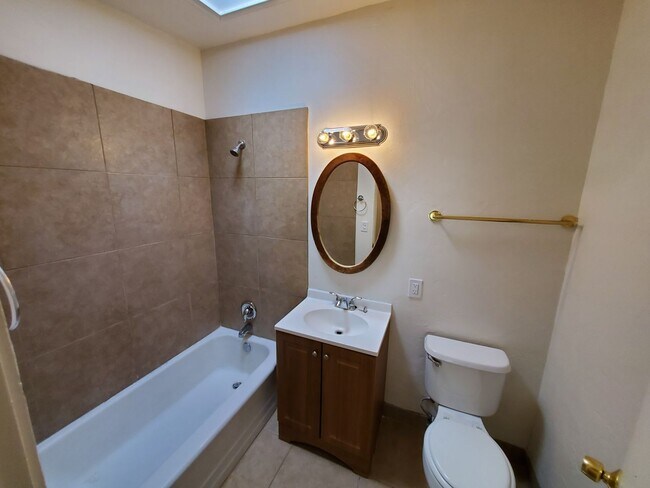 Building Photo - 4 bedrooms and 2 bathrooms with A/C.