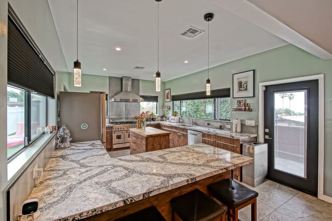 Building Photo - Beautifully Remodeled, Bright & Modern 4BR3BA Home w/ 2BR1BA Guest House On Sprawling Corner Lot ...