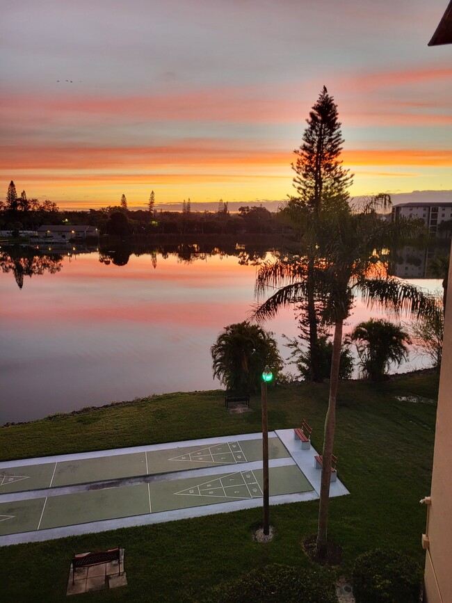 View from porch: Sunrise reflection in Lake - 3943 Lake Bayshore Dr