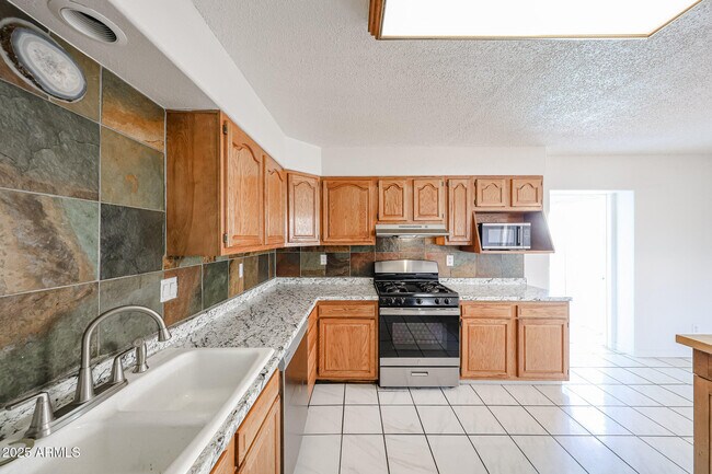 Building Photo - 3408 W Port Au Prince Ln