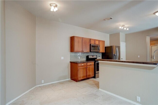 Building Photo - Charming One-Level 4 Bedroom Home with 2-C...