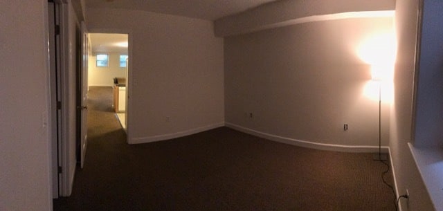 Bedroom with view out to open concept living area - 2935 N Charles St