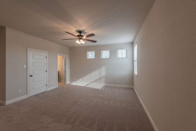 Building Photo - Fenced yard and two car garage!