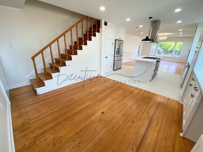 Building Photo - Spacious 4-Bedroom with Custom Finishes in...